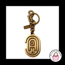Load image into Gallery viewer, NEW RARE COACH SPINNING RETRO GRAPHIC GOLD BRASS FOB BAG CHARM KEYCHAIN 79174