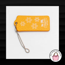 Load image into Gallery viewer, RARE COACH YELLOW FLOWER FLORAL LEATHER MAGNET FOB BAG CHARM KEYCHAIN HANG TAG
